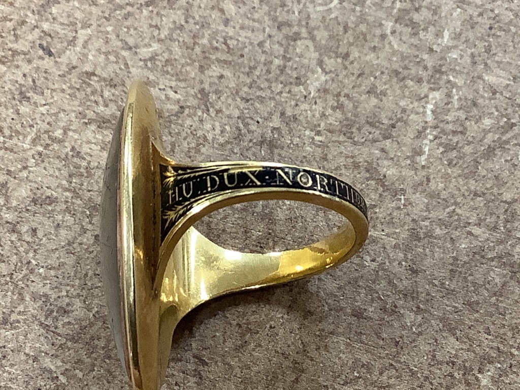 A George III yellow metal and three colour enamel navette shaped mourning ring, with Ducal coronet above 'N' on a pedestal with urn above, the shank with black enamel inscription which reads 'HU. DUX NORTHbr. OB 6 Jun. 1